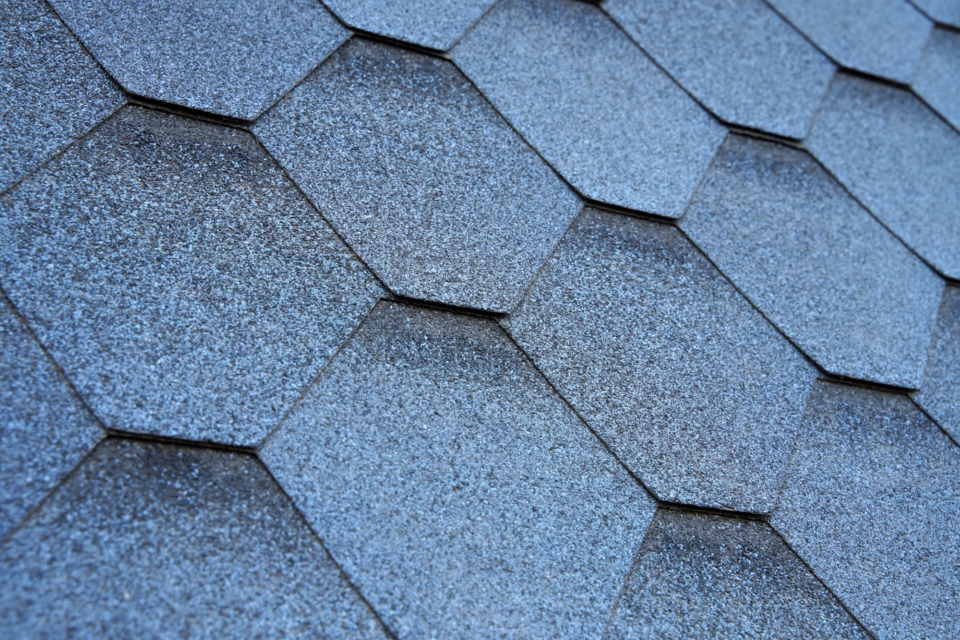 Close-up of a weathering asphalt shingle roof